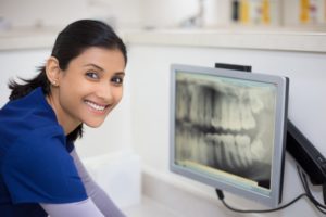 Dentist looking at an X-ray
