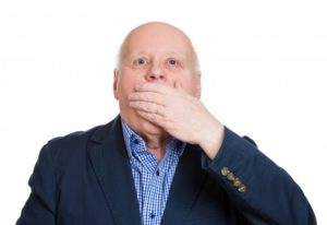 man covering his mouth